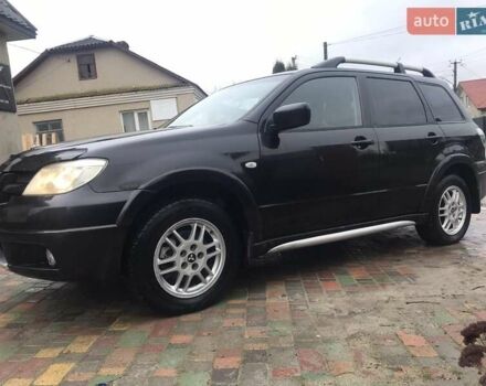 Черный Мицубиси Аутлендер, объемом двигателя 2 л и пробегом 284 тыс. км за 4500 $, фото 1 на Automoto.ua