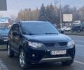 Черный Мицубиси Аутлендер, объемом двигателя 2.4 л и пробегом 240 тыс. км за 8300 $, фото 1 на Automoto.ua