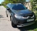Черный Мицубиси Аутлендер, объемом двигателя 3 л и пробегом 250 тыс. км за 8700 $, фото 1 на Automoto.ua