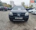 Черный Мицубиси Аутлендер, объемом двигателя 2 л и пробегом 500 тыс. км за 5500 $, фото 1 на Automoto.ua