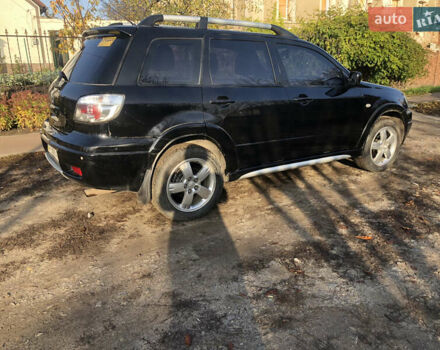 Черный Мицубиси Аутлендер, объемом двигателя 2.4 л и пробегом 260 тыс. км за 7200 $, фото 7 на Automoto.ua