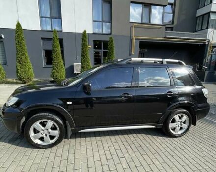 Черный Мицубиси Аутлендер, объемом двигателя 2.38 л и пробегом 310 тыс. км за 7500 $, фото 2 на Automoto.ua