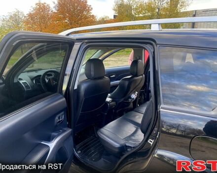 Черный Мицубиси Аутлендер, объемом двигателя 2 л и пробегом 207 тыс. км за 8100 $, фото 6 на Automoto.ua