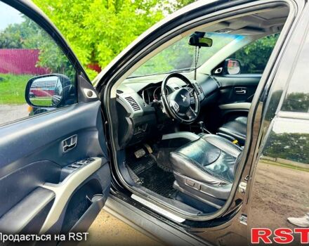 Черный Мицубиси Аутлендер, объемом двигателя 3 л и пробегом 200 тыс. км за 9799 $, фото 7 на Automoto.ua