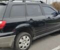 Чорний Міцубісі Аутлендер, об'ємом двигуна 2 л та пробігом 175 тис. км за 7800 $, фото 4 на Automoto.ua