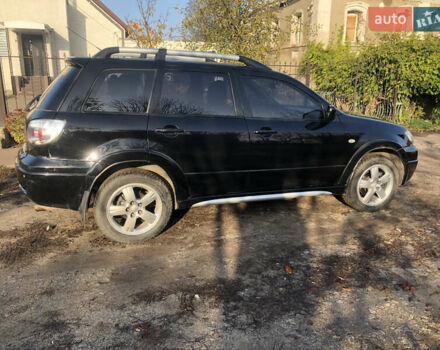 Черный Мицубиси Аутлендер, объемом двигателя 2.4 л и пробегом 260 тыс. км за 7200 $, фото 5 на Automoto.ua