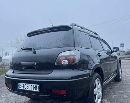 Чорний Міцубісі Аутлендер, об'ємом двигуна 2.38 л та пробігом 202 тис. км за 5800 $, фото 10 на Automoto.ua