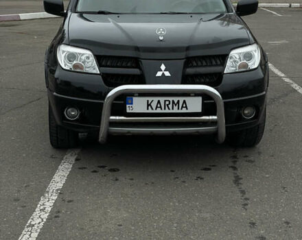 Чорний Міцубісі Аутлендер, об'ємом двигуна 2.38 л та пробігом 198 тис. км за 7100 $, фото 7 на Automoto.ua