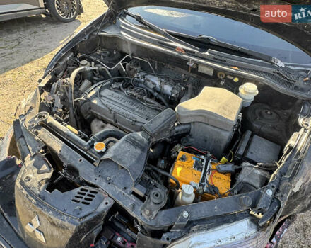 Черный Мицубиси Аутлендер, объемом двигателя 2 л и пробегом 258 тыс. км за 2200 $, фото 23 на Automoto.ua