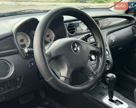 Черный Мицубиси Аутлендер, объемом двигателя 2.4 л и пробегом 320 тыс. км за 5999 $, фото 7 на Automoto.ua