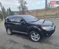 Черный Мицубиси Аутлендер, объемом двигателя 3 л и пробегом 220 тыс. км за 9000 $, фото 1 на Automoto.ua