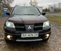 Чорний Міцубісі Аутлендер, об'ємом двигуна 2.4 л та пробігом 213 тис. км за 6850 $, фото 2 на Automoto.ua