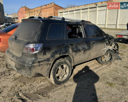 Черный Мицубиси Аутлендер, объемом двигателя 2 л и пробегом 258 тыс. км за 2200 $, фото 3 на Automoto.ua