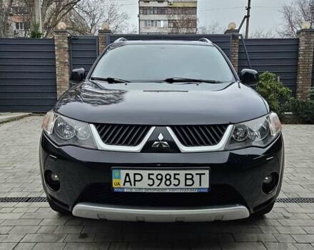 Черный Мицубиси Аутлендер, объемом двигателя 3 л и пробегом 238 тыс. км за 10800 $, фото 1 на Automoto.ua