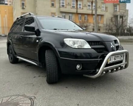 Черный Мицубиси Аутлендер, объемом двигателя 2.38 л и пробегом 319 тыс. км за 4800 $, фото 6 на Automoto.ua