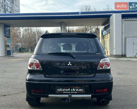 Черный Мицубиси Аутлендер, объемом двигателя 2.4 л и пробегом 320 тыс. км за 5999 $, фото 5 на Automoto.ua