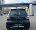 Черный Мицубиси Аутлендер, объемом двигателя 2.4 л и пробегом 320 тыс. км за 5999 $, фото 5 на Automoto.ua