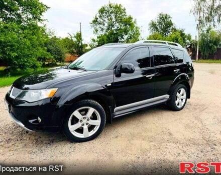 Черный Мицубиси Аутлендер, объемом двигателя 3 л и пробегом 200 тыс. км за 9799 $, фото 1 на Automoto.ua