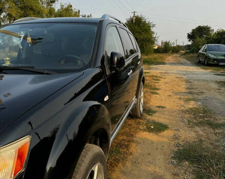 Черный Мицубиси Аутлендер, объемом двигателя 2 л и пробегом 200 тыс. км за 7700 $, фото 12 на Automoto.ua