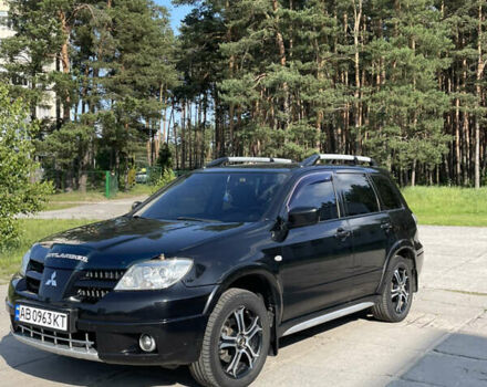 Чорний Міцубісі Аутлендер, об'ємом двигуна 2.38 л та пробігом 273 тис. км за 7100 $, фото 1 на Automoto.ua