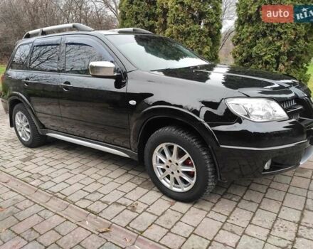 Черный Мицубиси Аутлендер, объемом двигателя 2 л и пробегом 180 тыс. км за 6000 $, фото 2 на Automoto.ua