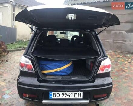 Черный Мицубиси Аутлендер, объемом двигателя 2 л и пробегом 284 тыс. км за 4999 $, фото 2 на Automoto.ua