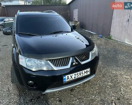 Черный Мицубиси Аутлендер, объемом двигателя 3 л и пробегом 270 тыс. км за 10600 $, фото 1 на Automoto.ua