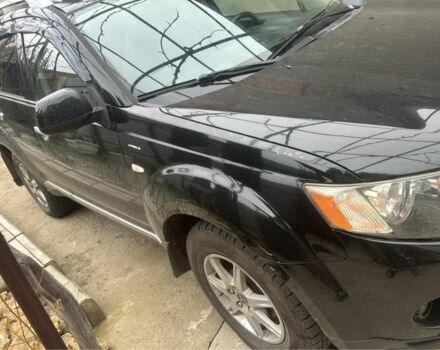 Черный Мицубиси Аутлендер, объемом двигателя 2.4 л и пробегом 240 тыс. км за 8500 $, фото 1 на Automoto.ua