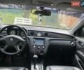 Черный Мицубиси Аутлендер, объемом двигателя 2.38 л и пробегом 274 тыс. км за 6500 $, фото 4 на Automoto.ua