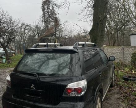 Черный Мицубиси Аутлендер, объемом двигателя 2 л и пробегом 430 тыс. км за 4300 $, фото 2 на Automoto.ua