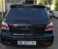 Черный Мицубиси Аутлендер, объемом двигателя 2.38 л и пробегом 269 тыс. км за 6900 $, фото 6 на Automoto.ua