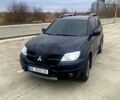 Чорний Міцубісі Аутлендер, об'ємом двигуна 2.4 л та пробігом 233 тис. км за 6350 $, фото 1 на Automoto.ua