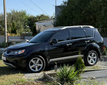 Черный Мицубиси Аутлендер, объемом двигателя 3 л и пробегом 180 тыс. км за 11200 $, фото 1 на Automoto.ua