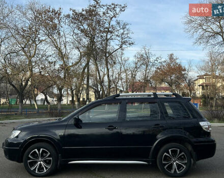 Черный Мицубиси Аутлендер, объемом двигателя 2.4 л и пробегом 320 тыс. км за 5999 $, фото 6 на Automoto.ua