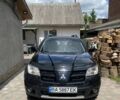 Черный Мицубиси Аутлендер, объемом двигателя 2.38 л и пробегом 274 тыс. км за 6500 $, фото 1 на Automoto.ua