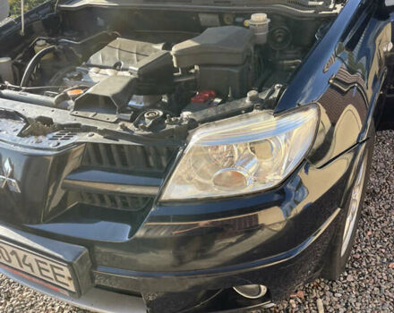 Черный Мицубиси Аутлендер, объемом двигателя 2.38 л и пробегом 118 тыс. км за 6850 $, фото 13 на Automoto.ua