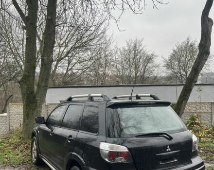 Черный Мицубиси Аутлендер, объемом двигателя 2 л и пробегом 430 тыс. км за 4300 $, фото 1 на Automoto.ua