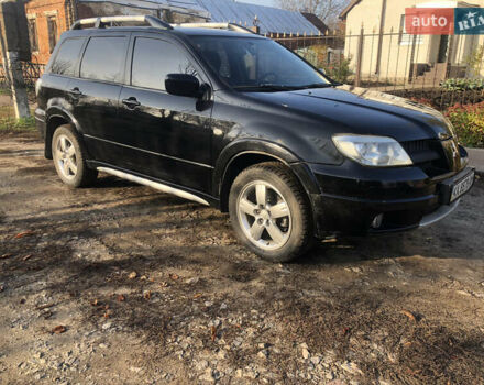Черный Мицубиси Аутлендер, объемом двигателя 2.4 л и пробегом 260 тыс. км за 7200 $, фото 3 на Automoto.ua
