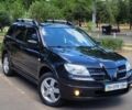 Чорний Міцубісі Аутлендер, об'ємом двигуна 2.4 л та пробігом 242 тис. км за 7100 $, фото 1 на Automoto.ua