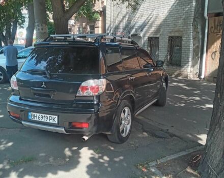 Черный Мицубиси Аутлендер, объемом двигателя 2.4 л и пробегом 248 тыс. км за 7000 $, фото 3 на Automoto.ua