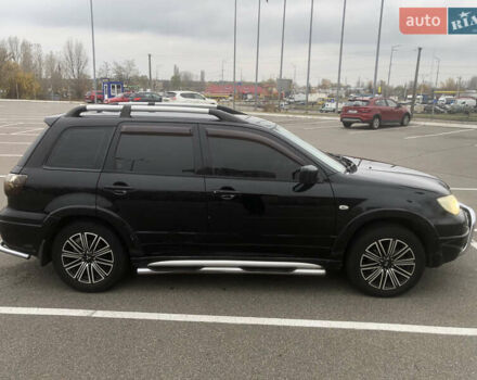 Черный Мицубиси Аутлендер, объемом двигателя 2.38 л и пробегом 314 тыс. км за 5000 $, фото 1 на Automoto.ua