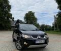 Черный Мицубиси Аутлендер, объемом двигателя 2.4 л и пробегом 200 тыс. км за 7500 $, фото 1 на Automoto.ua