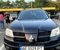 Черный Мицубиси Аутлендер, объемом двигателя 2.38 л и пробегом 191 тыс. км за 8300 $, фото 1 на Automoto.ua