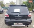 Черный Мицубиси Аутлендер, объемом двигателя 2 л и пробегом 500 тыс. км за 5500 $, фото 2 на Automoto.ua