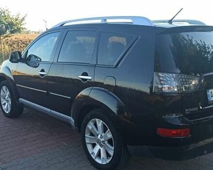 Черный Мицубиси Аутлендер, объемом двигателя 1.97 л и пробегом 244 тыс. км за 9000 $, фото 2 на Automoto.ua