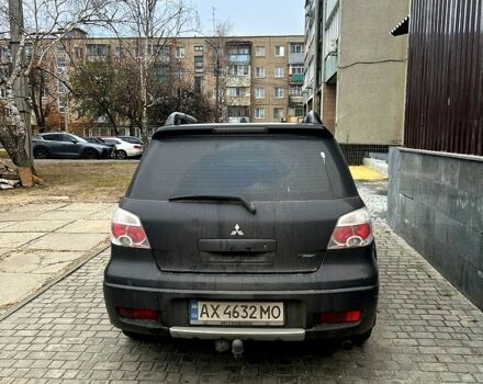 Чорний Міцубісі Аутлендер, об'ємом двигуна 2.4 л та пробігом 267 тис. км за 6000 $, фото 4 на Automoto.ua