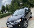Черный Мицубиси Аутлендер, объемом двигателя 2.4 л и пробегом 200 тыс. км за 7500 $, фото 2 на Automoto.ua