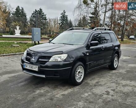 Чорний Міцубісі Аутлендер, об'ємом двигуна 2 л та пробігом 290 тис. км за 5000 $, фото 1 на Automoto.ua