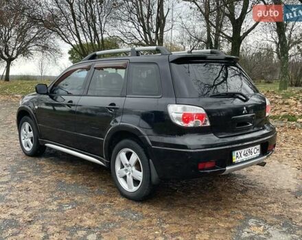 Чорний Міцубісі Аутлендер, об'ємом двигуна 2.4 л та пробігом 213 тис. км за 6850 $, фото 8 на Automoto.ua