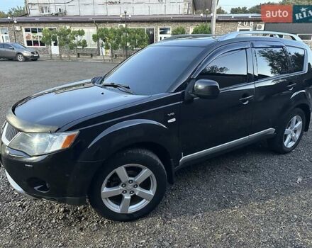 Черный Мицубиси Аутлендер, объемом двигателя 3 л и пробегом 270 тыс. км за 10600 $, фото 2 на Automoto.ua